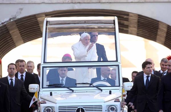 Pope Benedict XVI waves to the faithful as he arrives in St. Peter's Square for his final general audience on Feb. 27, 2013 in Vatican City, Vatican.