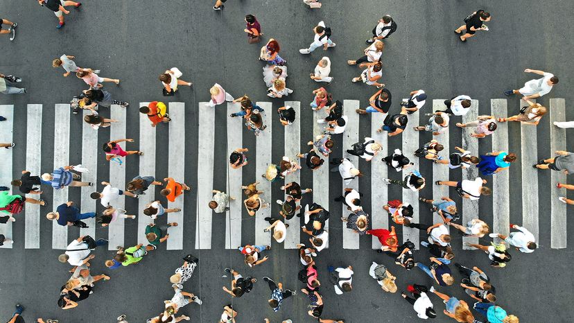  People crowd on pedestrian crosswalk. Top view background.