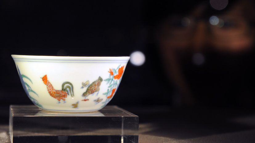 A rare cup of Chinese porcelain with images of chickens on it.