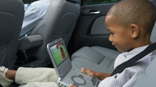 Is it more affordable to have a portable DVD player in your car or have the dealer install one?