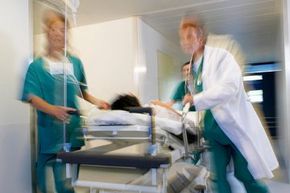 ER, doctors rushing patient thru hospital