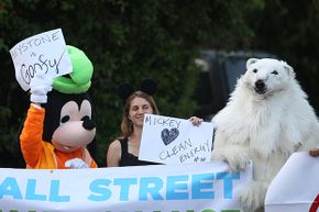 Ileene Anderson, dressed as Goofy, Valeria Love and Andrea Weber, dressed as a polar bear called Frostpaw, rally against the Keystone XL Canada-to-Texas pipeline project in Bel-Air, California in 2014.