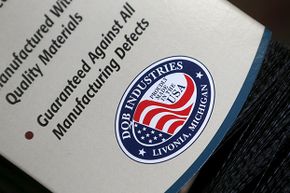 A &quot;proudly made in the USA&quot; logo is seen on the packaging of a brush produced at Detroit Quality Brushes in Livonia, Michigan. Not all companies that display this logo really  make their products in America.