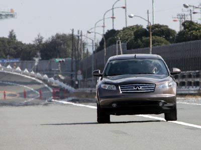 Pre-collision systems assist drivers in identifying oncoming crashes and correcting the car's path for minimal damage. Here, a Nissan car swerves back into the lane using a technology called Lane Departure Prevention.