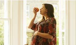 woman smelling foods