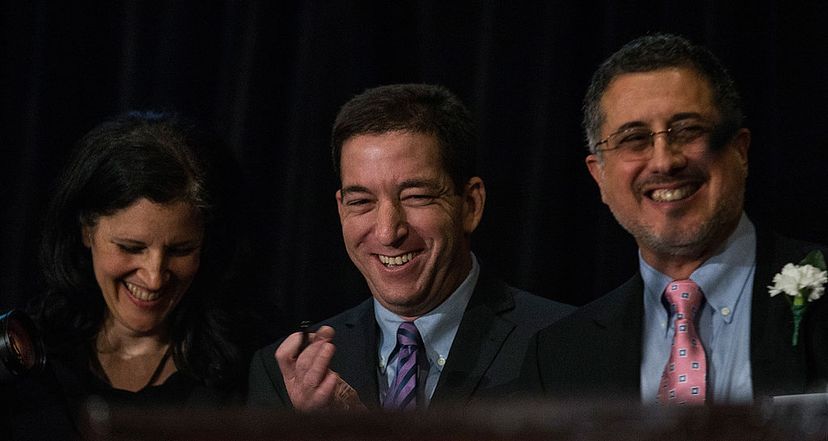 Laura Poitras (L), Glenn Greenwald (C), and Barton Gellman (R), who all worked with National Security Agency leaker Edward Snowden, wait to accept the George Polk Award for national security reporting on April 11, 2014, in New York City. Andrew Burton / Getty Images