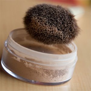 loose powder and makeup brush