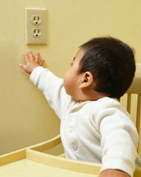 baby reaching for outlet