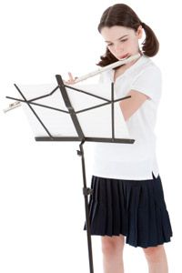 private school student playing the flute