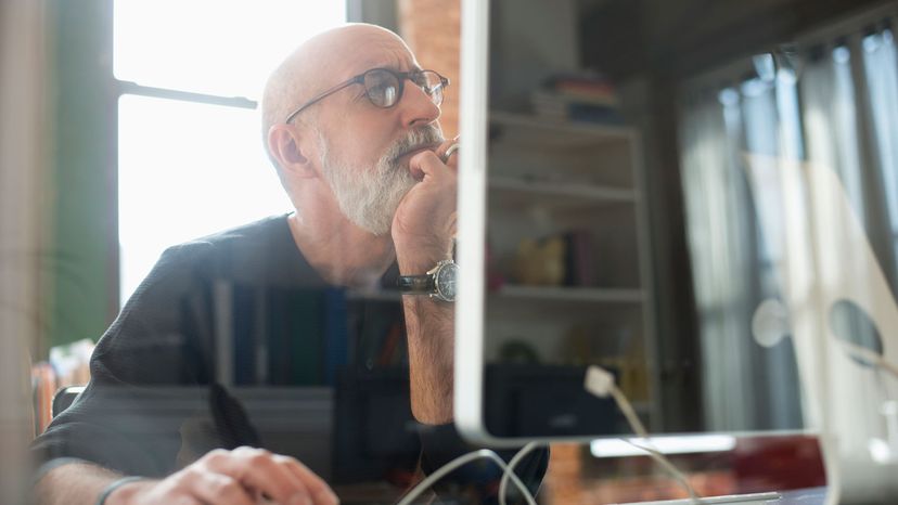 man looking at screen