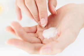 woman's  hands with cream