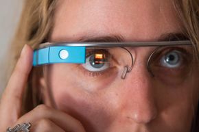 A woman tries on Google Glass at an event in 2013.