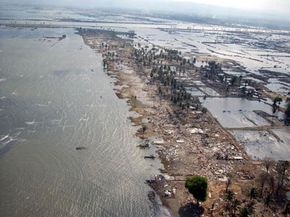 Six weeks after the 2004 tsunami, one can barely tell where the sea ends and the Banda Aceh, Indonesia shoreline begins.