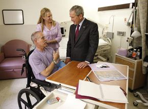 Former President George W. Bush visits Army Brigadier General William Fox, Jr. at Walter Reed Army Medical Center in Washington, D.C.