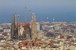 The Sagrada Familia cathedral in Barcelona towers over the city. It's been in construction since 1883.