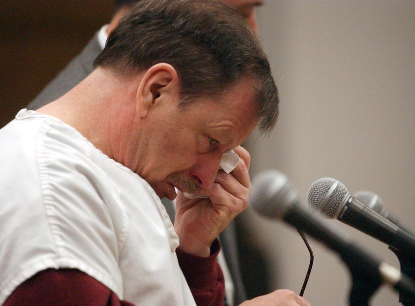 Green River Killer Gary Leon Ridgway cries as he reads a statement in court, Dec. 18, 2003, in Seattle. Ridgway received 48 life sentences, without the possibility of parole, for killing 48 women. Elaine Thompson-Pool/Getty Images