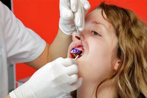 girl getting fluoride treatment