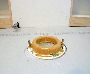 Wax seal over drain pipe flange