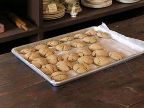 Using a good cookie sheet and lining it with parchment paper is an easy way to improve your cookie production.