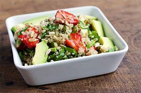 Here's a nutrient-rich salad comprising quinoa, strawberries, avocados and spinach.