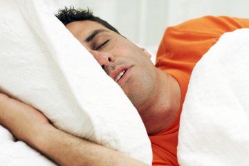 Man sleeping in bed, close-up