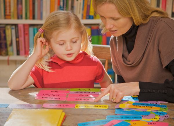 A teacher teaches a student.