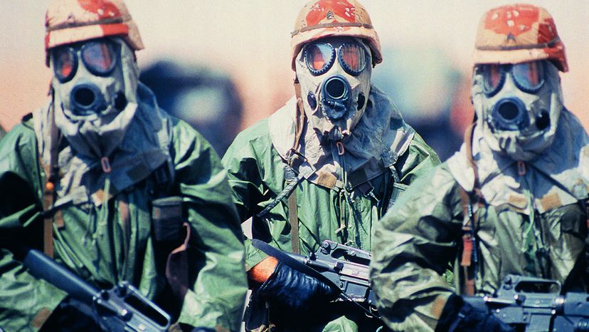 War Soldiers with Guns and Gas Masks