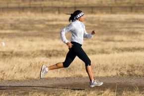 Athlete running while jogging and exercising.