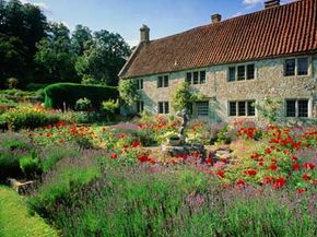 House in gardens, English countryside.