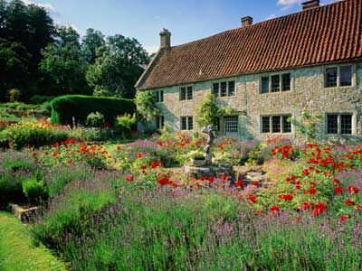 House in gardens, English countryside.