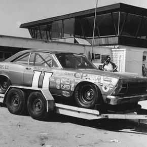 In the good old days, most drivers towed their race cars on open flatbed trailers like this one.