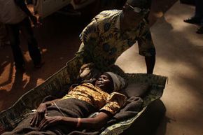A woman is brought to a health clinic with an advanced case of rabies in Kabo in the northern Central African Republic.