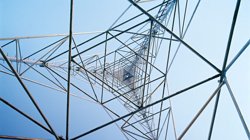 Communications Tower Worker Scaling Tower