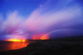 A moonbow appears near dawn in Hawaii.