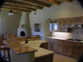 The kitchen of a rammed earth house.