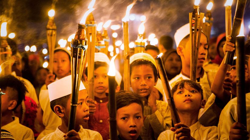 Children carry torches to celebrate the beginning of Ramadan, a time of fasting and prayer for Muslims. Oscar Siagian/Getty Images