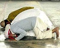 Muslims bowing in prayer