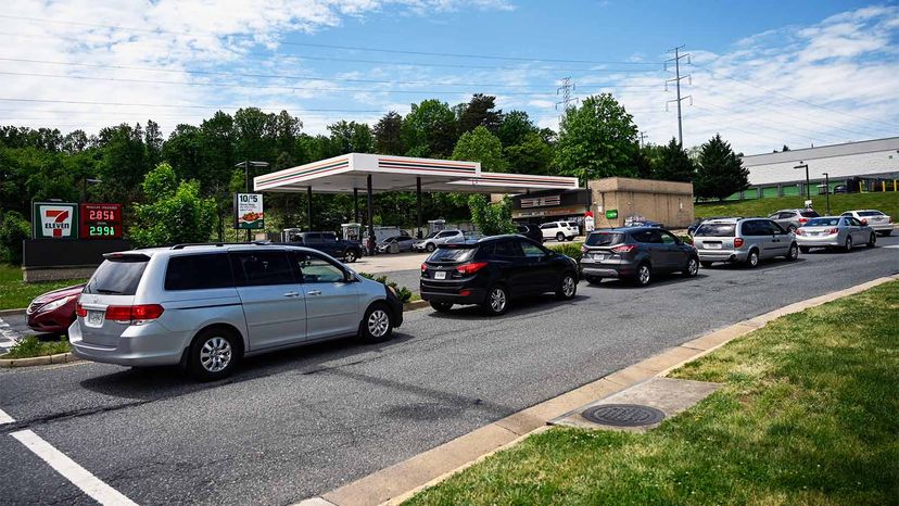 cars lined up at gas station