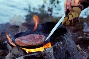 Image Gallery: Grilling Steak, Step-by-Step Rare, but not raw. Even in the wilderness, you should cook the meat you kill. See more steak grilling pictures.