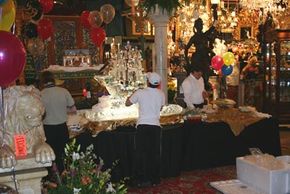 Red Baron's Antiques catering crew puts the final touches on the buffet served the night of the preview party.