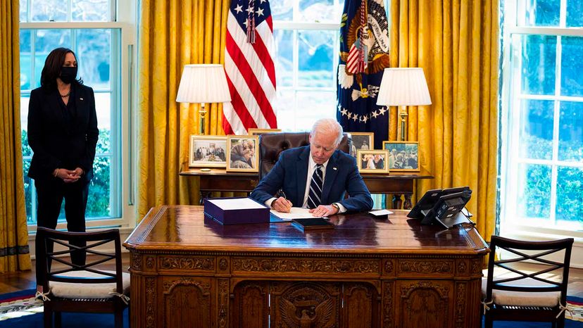 Joe Biden signing COVID bill
