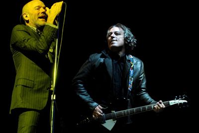 Michael Stipe and Peter Buck of REM perform.