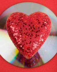 A big, red and shiny heart on a CD/DVD.