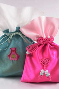 Pretty pink and green Asian bags