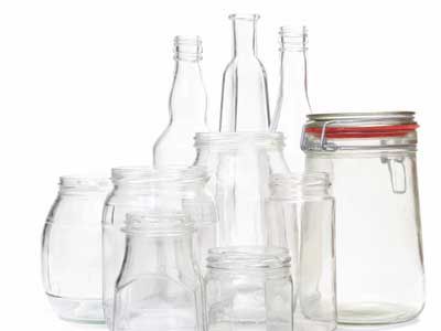 Clear glass jars and bottles over white.
