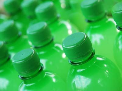 Market view of plastic soda bottles.