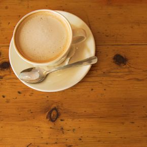 A cup of coffee on a wooden table