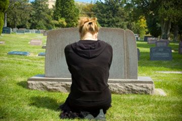 woman at graveside