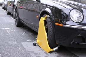 If you find your car clamped, your only hope (outside of paying the associated fees) may be Angle Grinder Man.