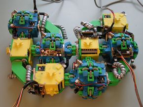 Rus Robotics Laboratory's Molecule modules feature two cubes connected at a 90 degree angle. One surface on each cube houses the bond that connects it to the other half of the module. The other five surfaces can attach to other modules.